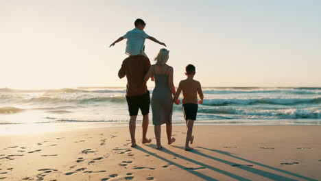 Beach-sunset,-children-and-parents-walking