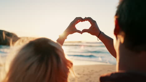 Heart,-hands-and-couple-zoom-at-a-beach-with-love