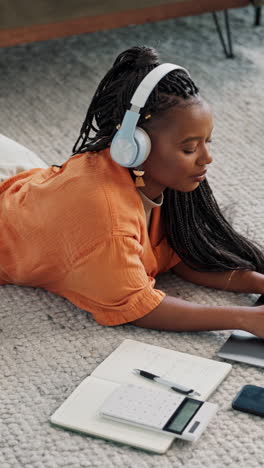Remote-work,-headphones-and-black-woman-on-laptop