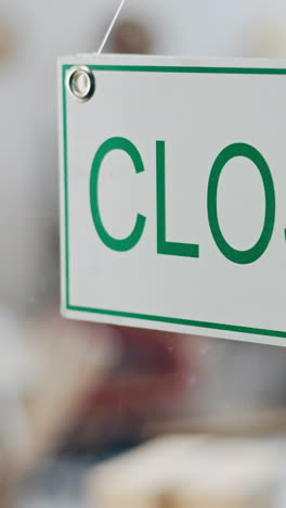 Closed,-sign-and-window-closeup-for-business-store
