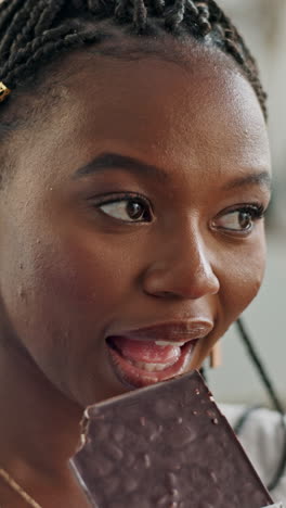 Black-woman,-eating-and-chocolate-to-enjoy