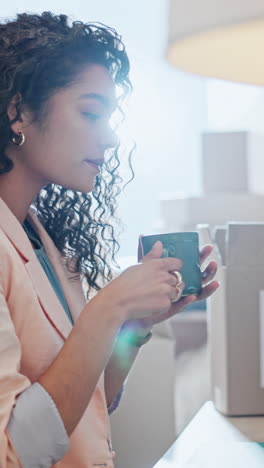 Woman,-coffee-and-boxes-in-logistics-office