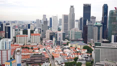Luftaufnahme-Der-Gebäude-Der-Stadt-Singapur,-Sonniger-Tag,