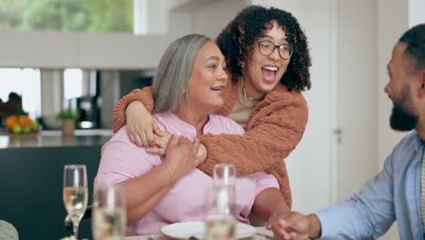 Hug,-senior-mother-and-woman-at-table-with-family