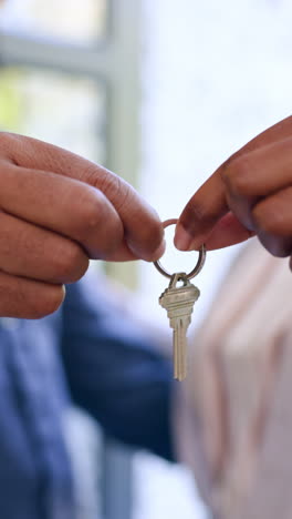 Couple,-hands-and-closeup-of-house-keys-for-real