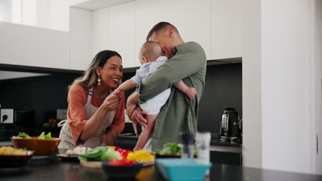 Baby,-funny-and-a-couple-cooking-in-the-kitchen