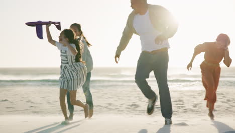 Parents,-children-and-plane-with-running-on-beach
