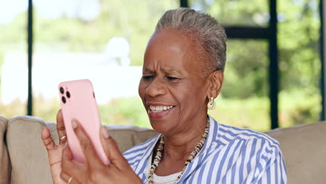 Phone,-video-call-and-senior-black-woman-on-a-sofa