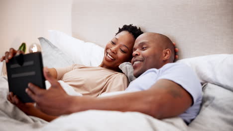Home,-bed-and-black-couple-with-a-tablet