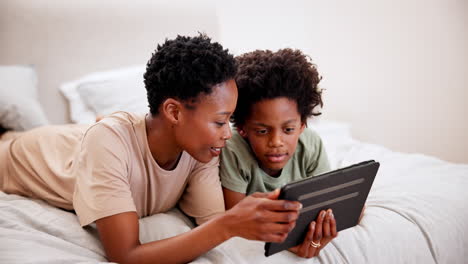Black-mother,-smile-and-kid-on-tablet-in-bedroom