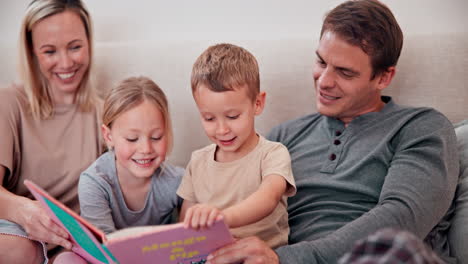 Parents,-children-and-reading-books-in-bedroom