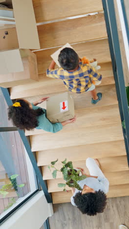 New-home,-box-and-family-on-stairs-for-moving-day