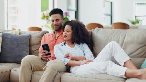 Couple,-phone-and-relax-on-sofa-with-conversation