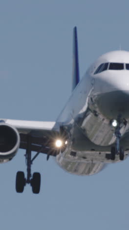 airplane-landing-at-barcelona-airport-in-vertical