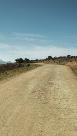 driving-in-atlas-mountains,-morocco-in-vertical