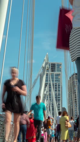 crowds-rushing-past-on-tower-bridge,-london-in-vertical