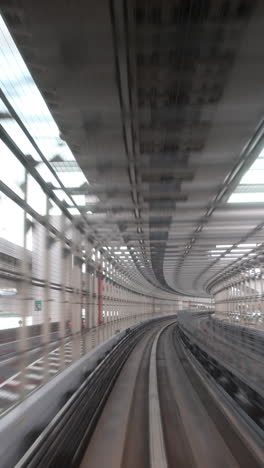 tokyo-monorail-passing-through-the-city's-skyscapers-in-vertical