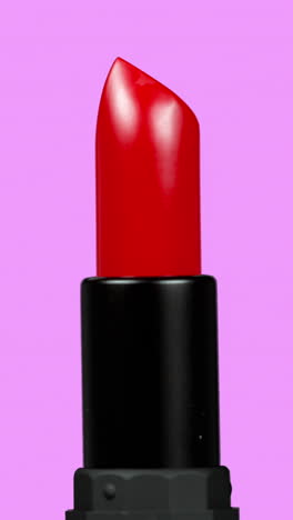 lipstick-turning-against-a-plain-white-background-in-vertical-format