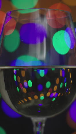 red-wine-in-disco-lights-in-vertical-video