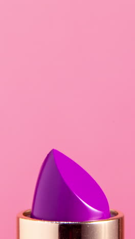 lipstick-turning-against-a-plain-white-background-in-vertical-format