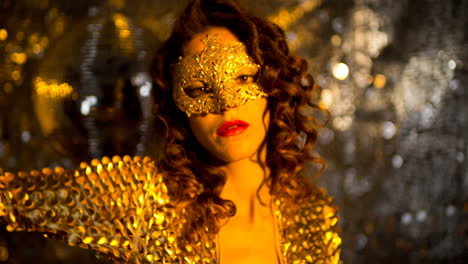 Woman-with-gold-masquerade-mask-dancing