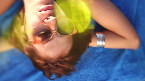 Woman-sunbathing-on-the-beach