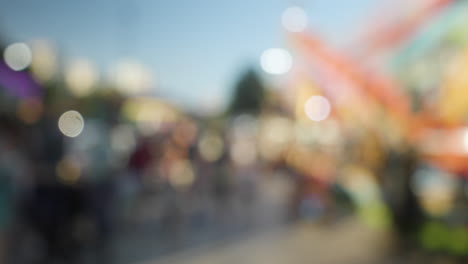 A-blurred-crowd-walking-at-a-funfair