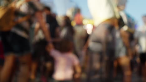 A-blurred-crowd-walking-at-a-funfair