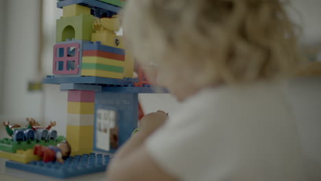 Small-girl-playing-with-building-blocks