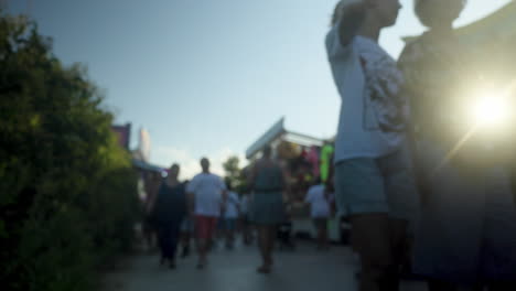 A-blurred-crowd-walking-at-a-funfair