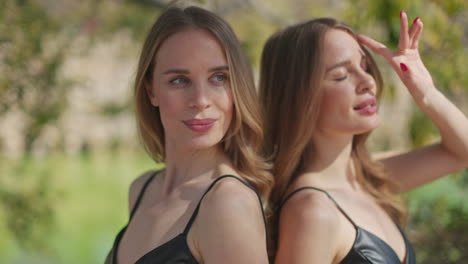 Identical-twins-posing-outdoors