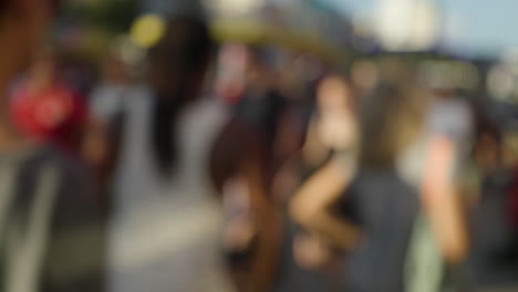 A-blurred-crowd-walking-at-a-funfair