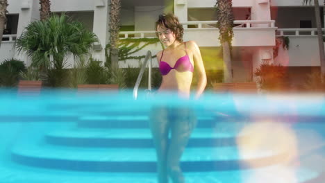 Woman-posing-in-a-swimmimng-pool