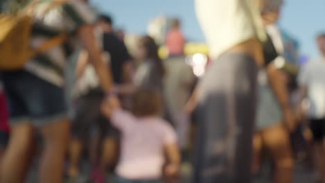 A-blurred-crowd-walking-at-a-funfair