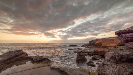 Rocky-coastline-at-sunset-timelapse