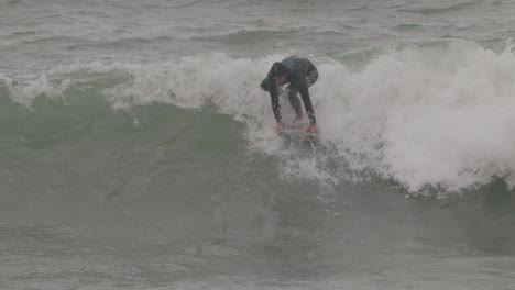 Male-surfer-riding-a-wave