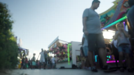 A-blurred-crowd-walking-at-a-funfair