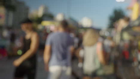 A-blurred-crowd-walking-at-a-funfair