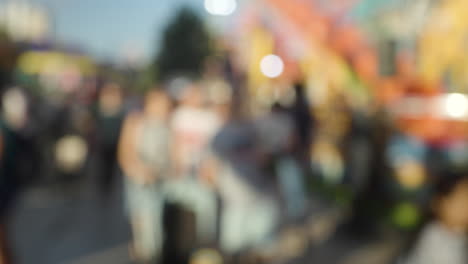 A-blurred-crowd-walking-at-a-funfair