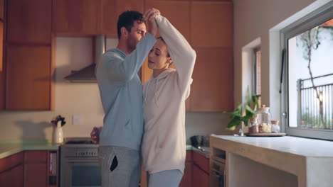 Dance,-love-or-happy-couple-in-kitchen