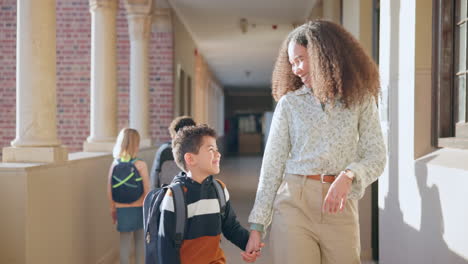 School,-kid-and-mother-smile-holding-hands-walking