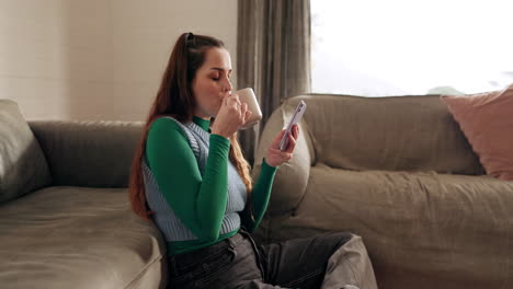 Phone,-coffee-and-young-woman-in-the-living-room