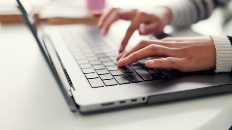 Student,-hands-and-typing-on-laptop-keyboard