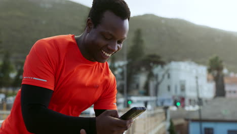 Runner-black-man,-phone-and-texting-outdoor