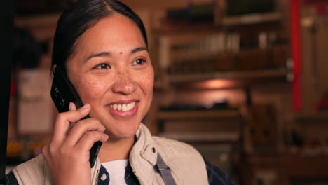 Phone-call,-industry-and-Asian-woman-carpenter