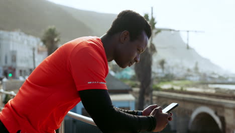 Outdoor,-fitness-and-black-man-with-a-smartphone
