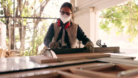 Wood,-tools-and-saw-with-woman-in-workshop