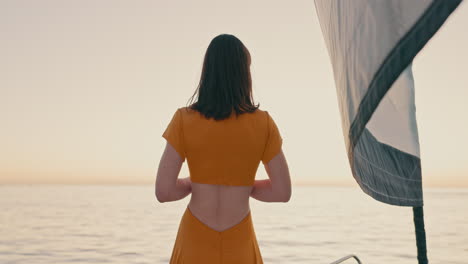 Back,-sunset-and-horizon-with-a-woman-on-a-yacht