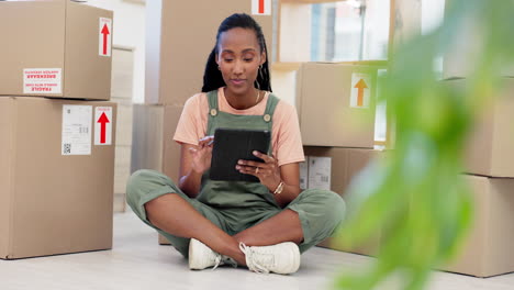 Black-woman,-boxes-or-tablet-for-online-shopping