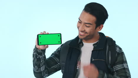 Happy-asian-man,-phone-and-pointing-to-green